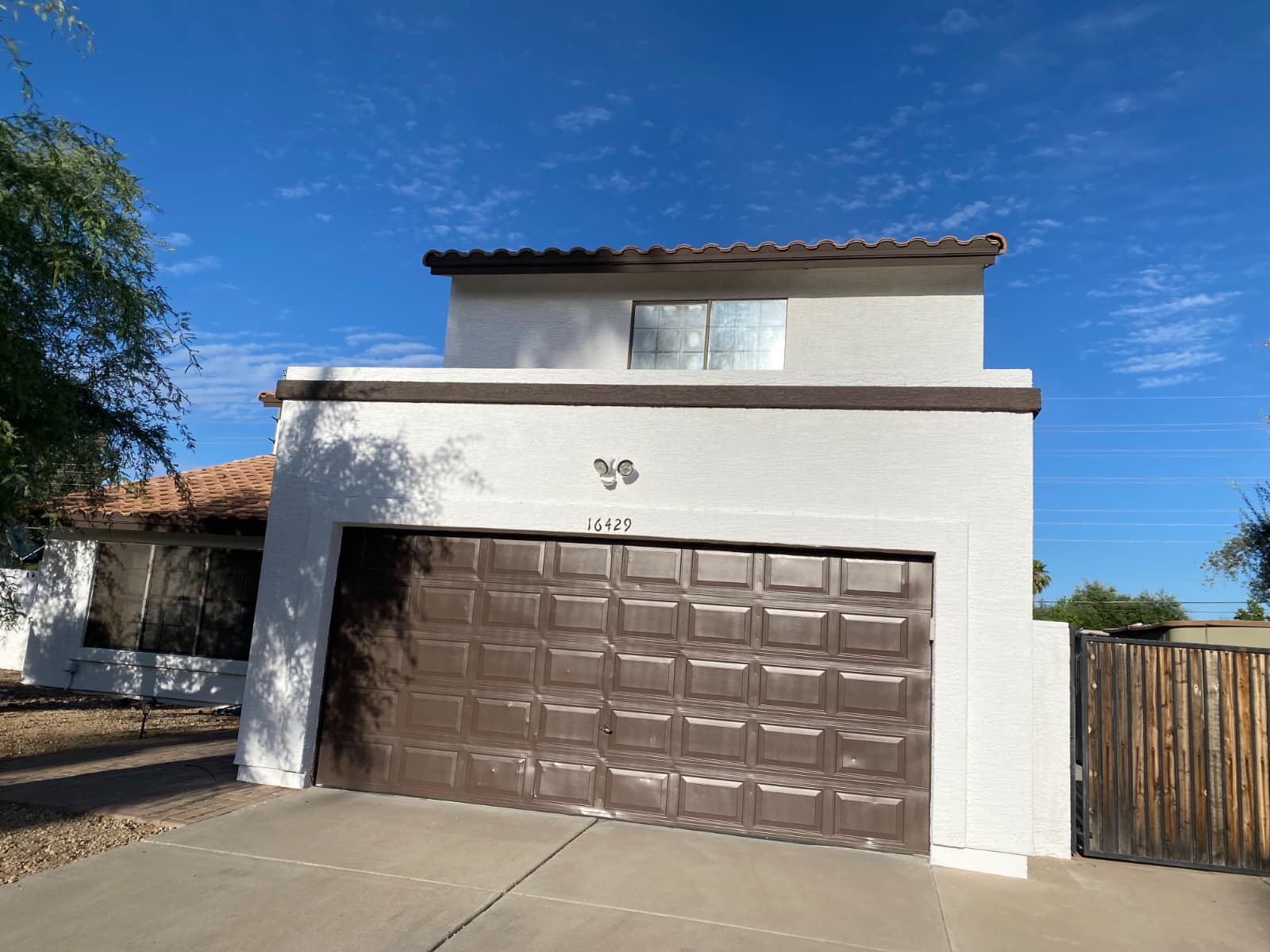 Freshly painted white stucco home exterior by F.V Painting LLC in Phoenix Arizona